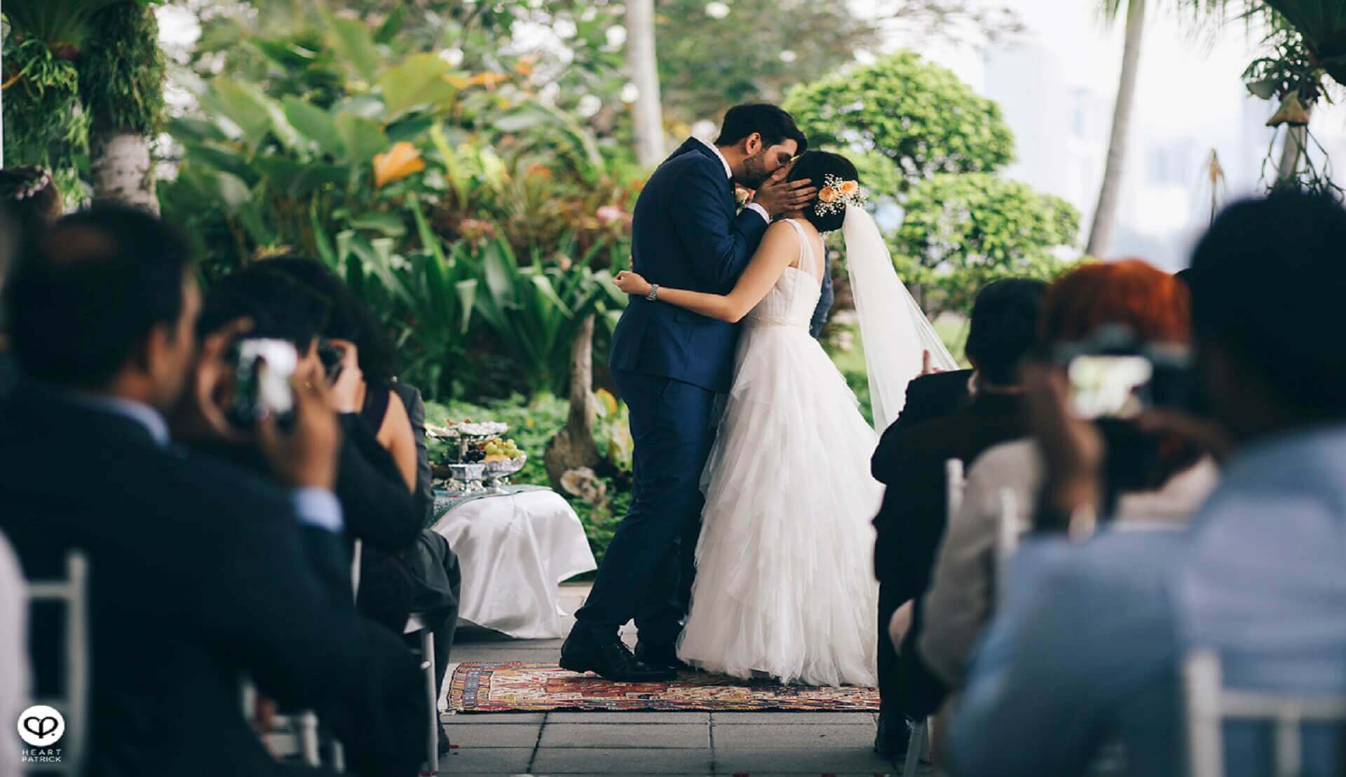 Sugar & Spice Events - Groom kissing the bride after vow exchange ceremony